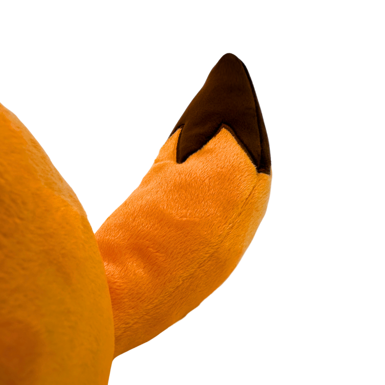 かわいい細身の落ち込んだオレンジ色のキツネぬいぐるみ