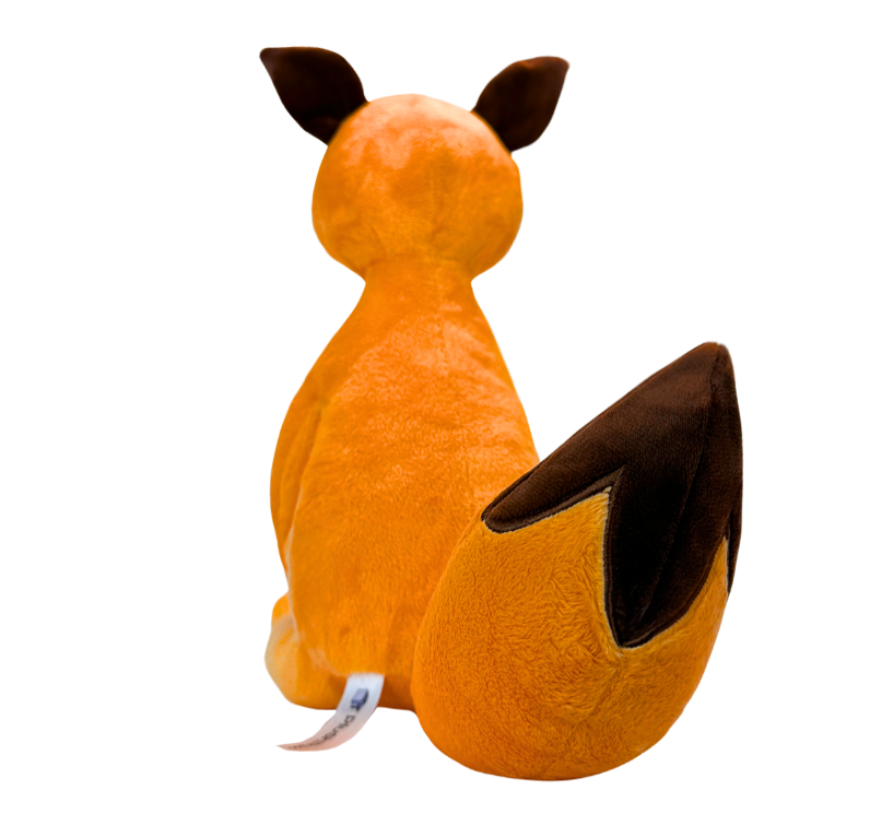 かわいい細身の落ち込んだオレンジ色のキツネぬいぐるみ