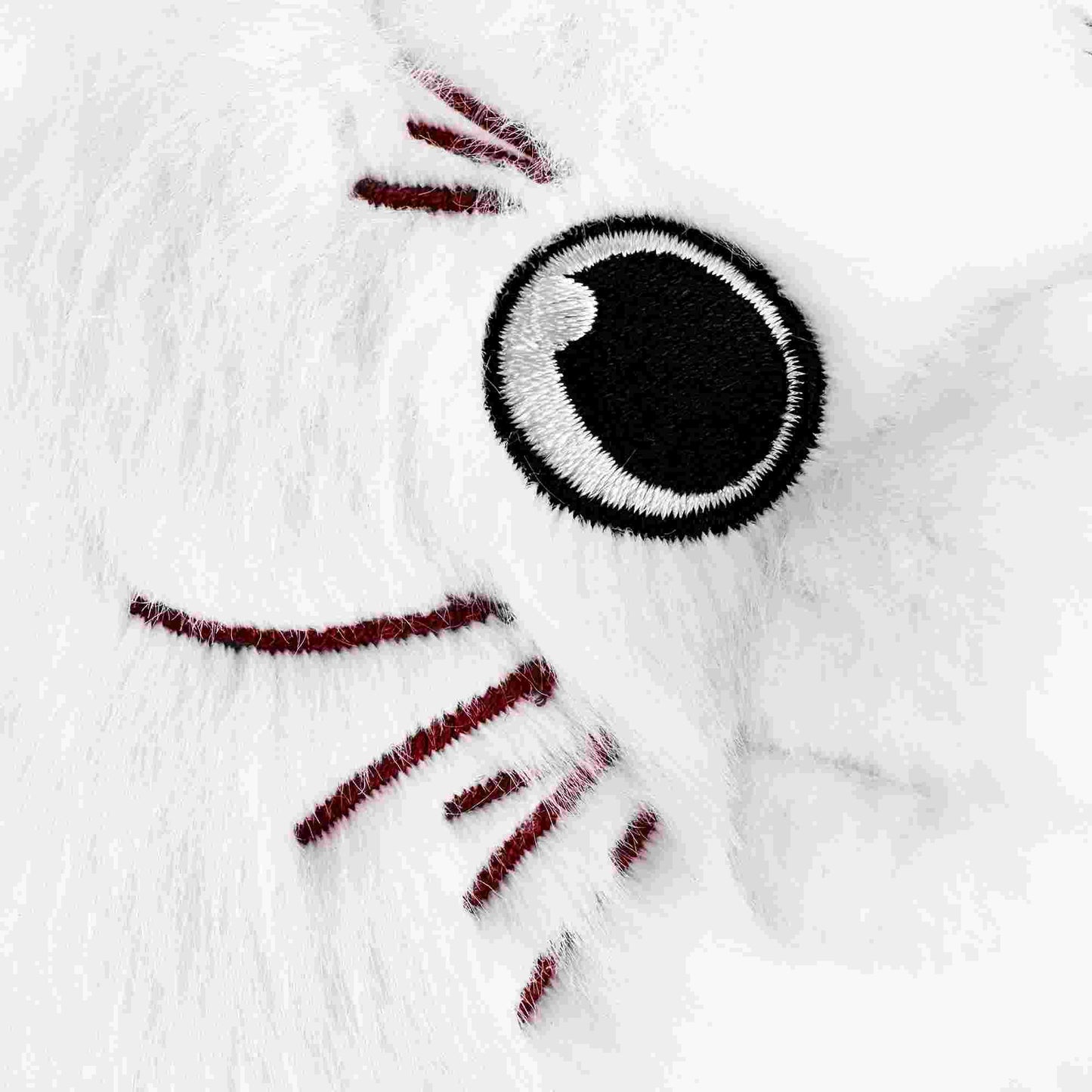 かわいい好奇心旺盛な白い猫のぬいぐるみ