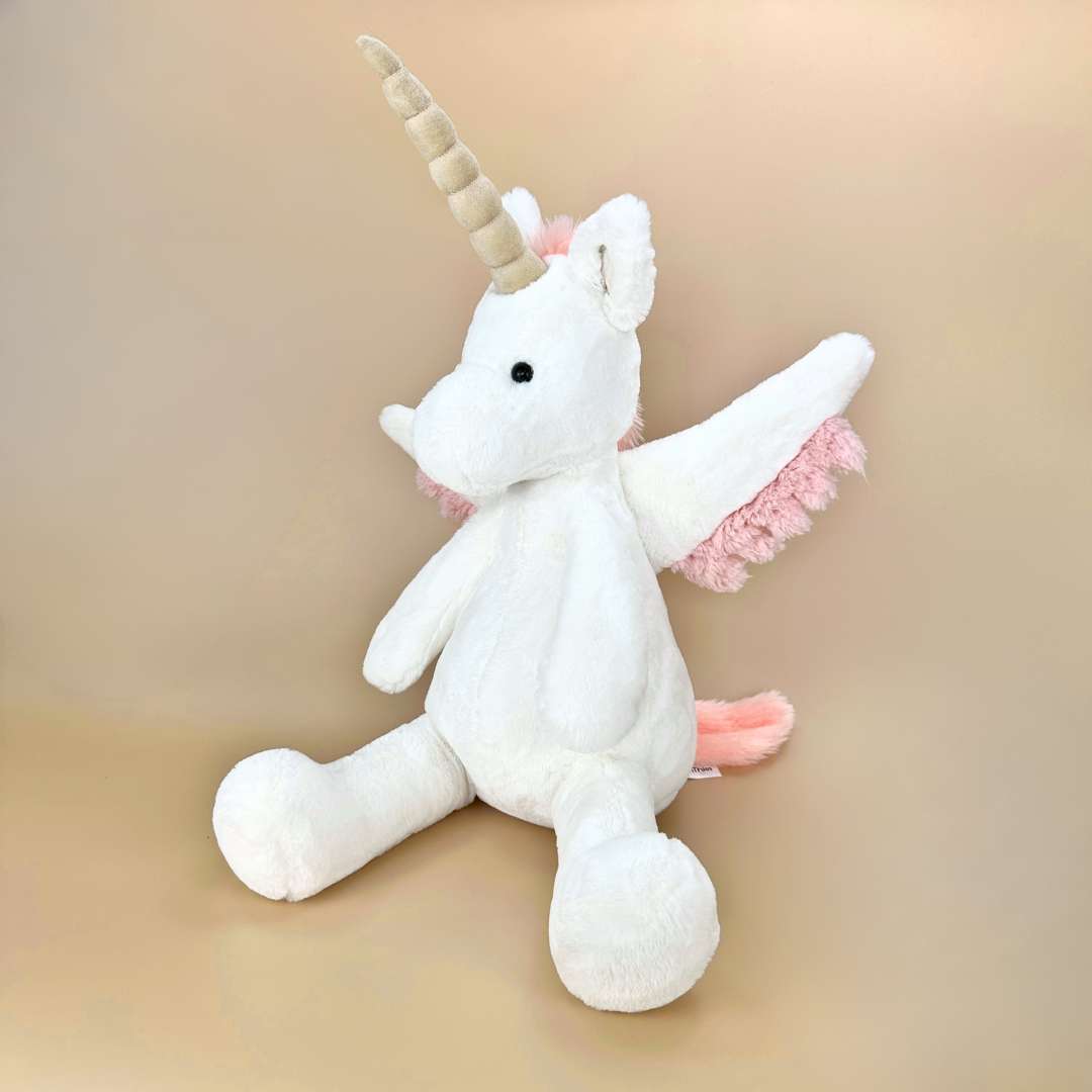 可愛い白とピンクのユニコーンぬいぐるみ
